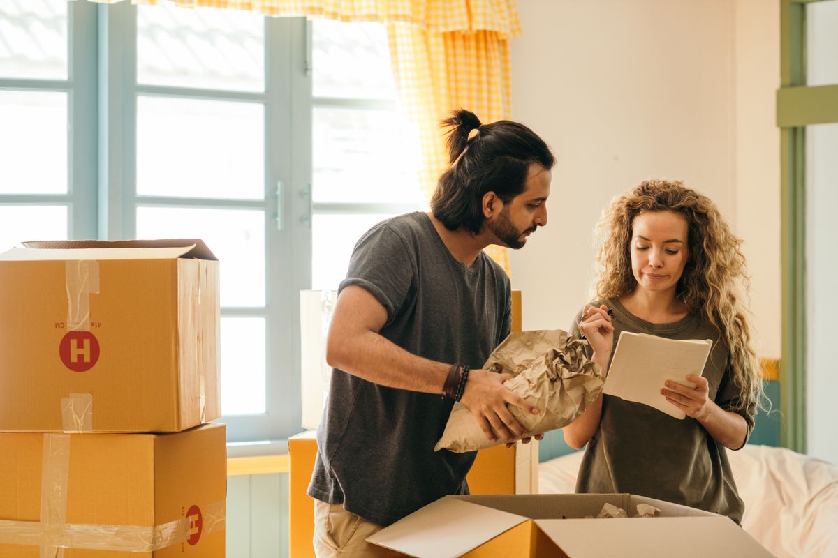 First-time buyers unpacking boxes in their new Metro East home